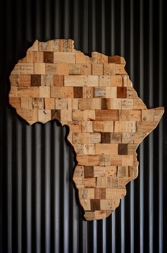 pexels photo 2660262 Artistic wooden map of Africa against dark corrugated background.